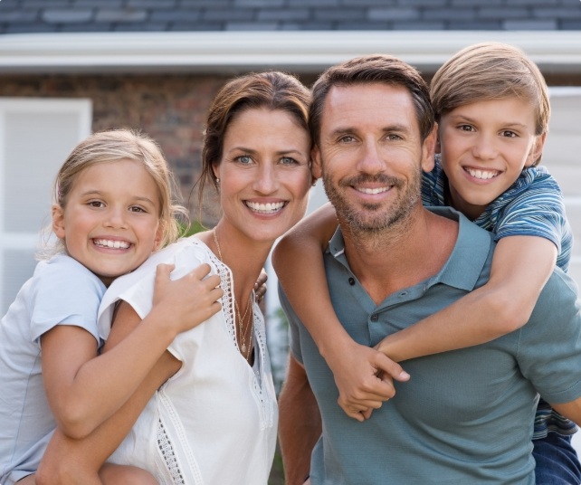 Parents and child smiling together