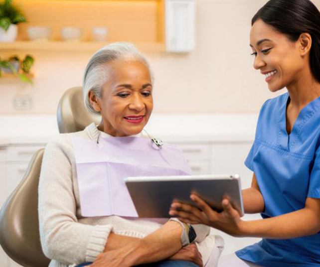 Dentist and patient talking during consultation