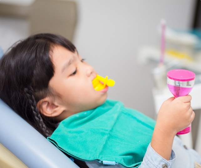 Child receiving fluoride treatment