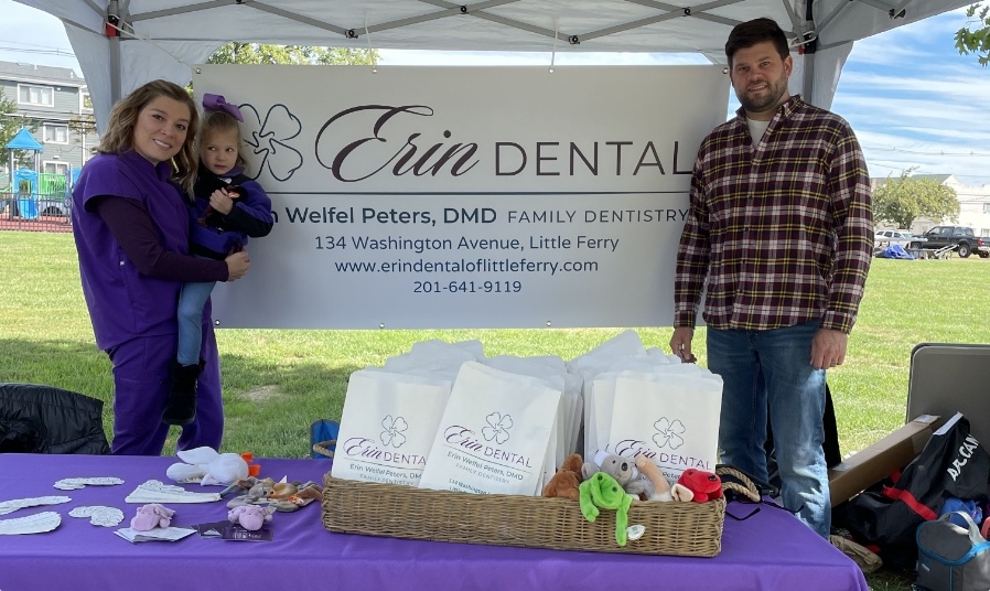 Dental team member and family at Erin Dental booth