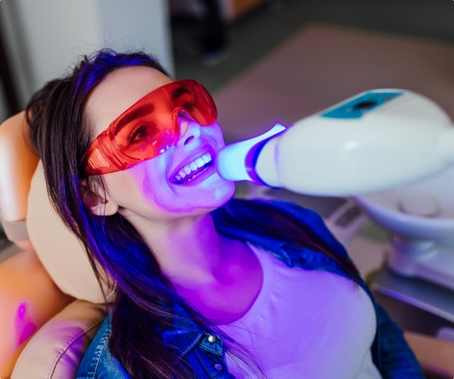 Dental patient receiving teeth whitening
