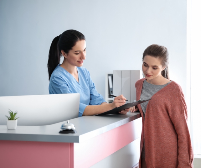 Dental team member and patient discussing the cost of emergency dentistry