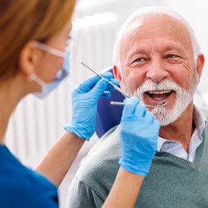 Mature man smiling during dental checkup