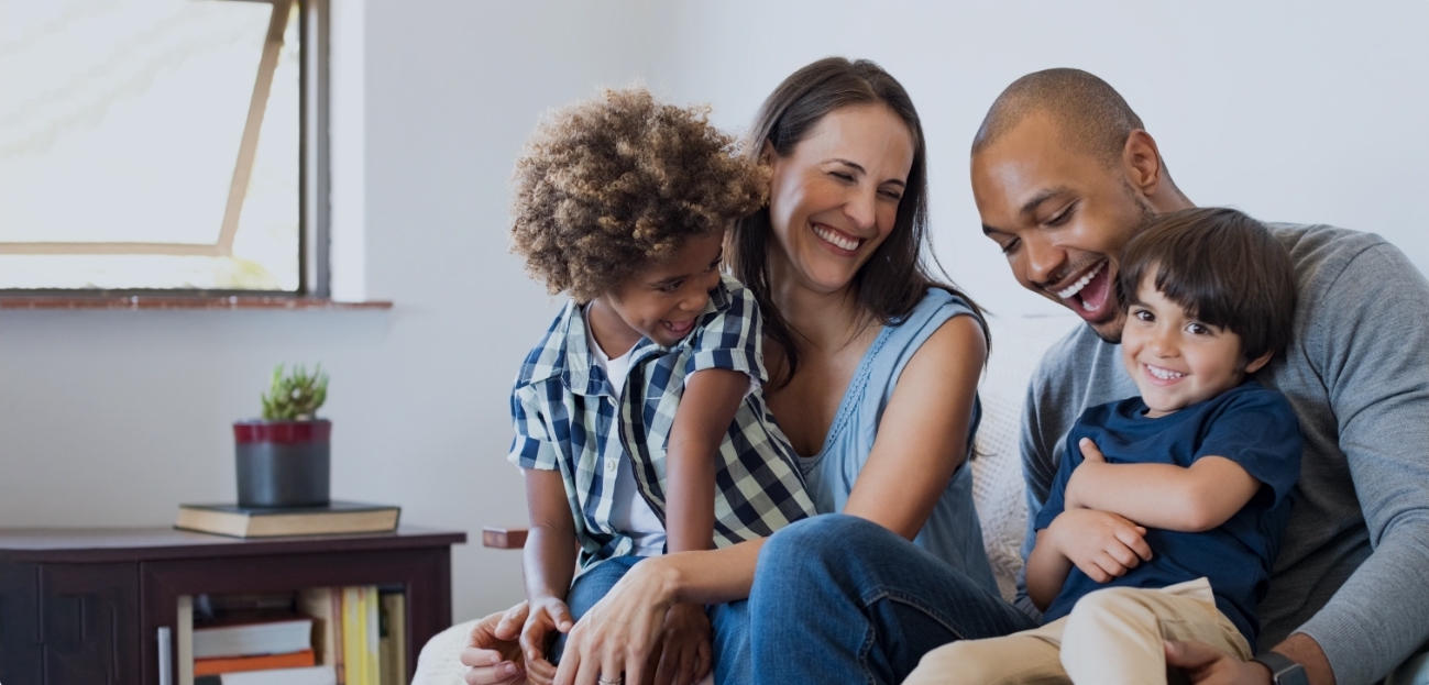 Parents and children smiling while visiting the family dentist in Little Ferry New Jersey