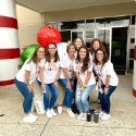 Group of dental team members in matching shirts at community event