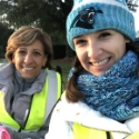 Two smiling dental team members at community event