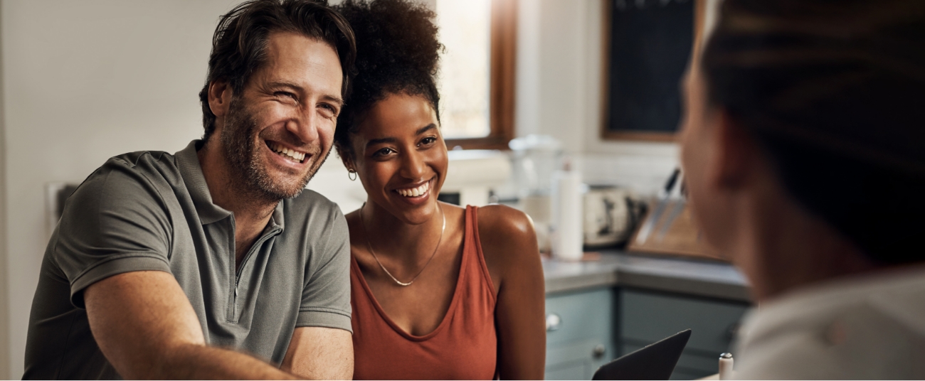 Man and woman smiling together after visiting the dentist