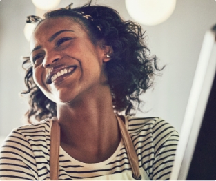 Woman sharing smile after preventive dentistry visit