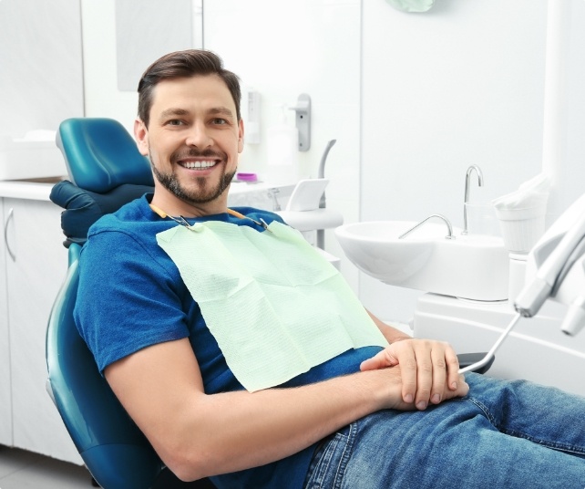 Man smiling during preventive dentistry checkup and teeth cleaning visit