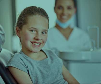 Child in dental chair for children's dentistry visit