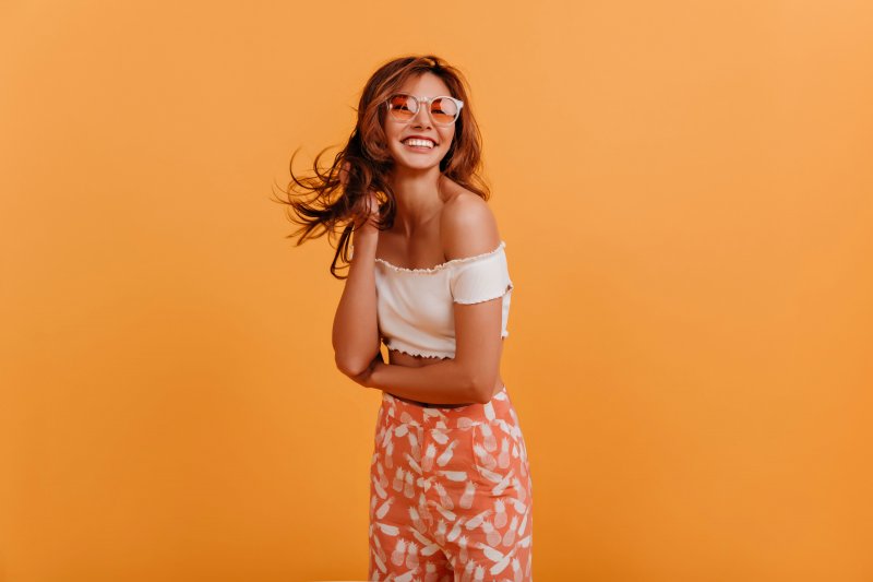 Person smiling in a summer outfit