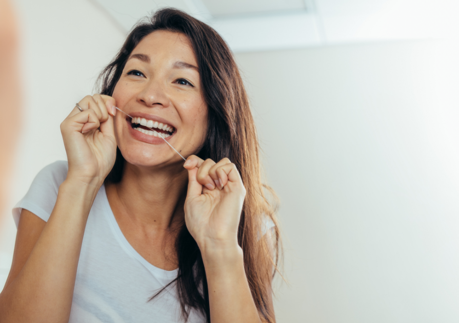 Woman flossing